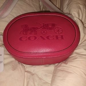 Your best offer.    Coach Leather, pink, and round crossbody bag